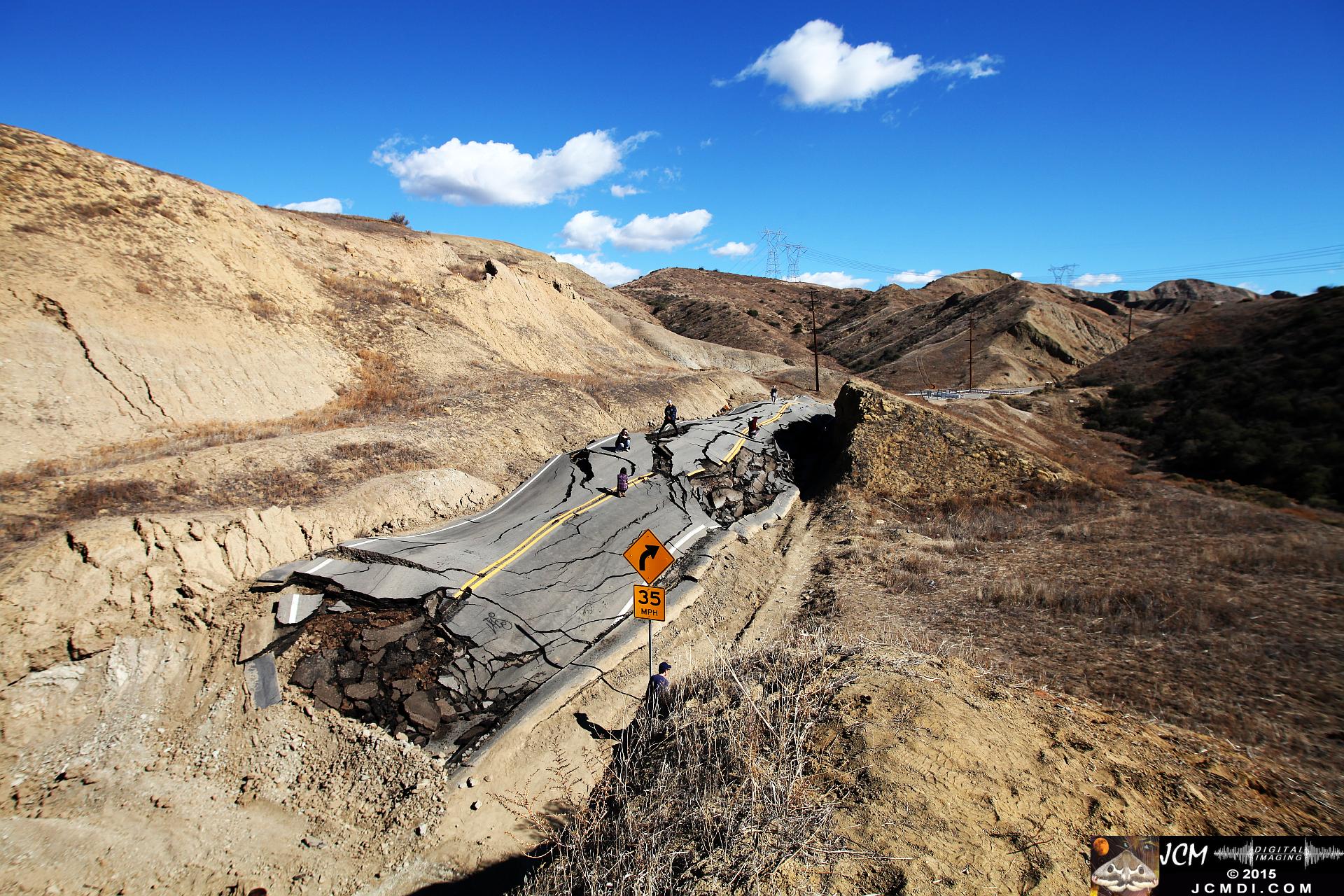 Landslide, buckled pavement, and terrain at Vasquez Canyon Road in Santa Clarita, CA filmed 11-25-2015